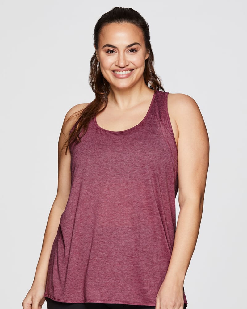 Front of a model wearing a size 1X Prime Relaxed Twist Back Tank Top in Berry by RBX Active. | dia_product_style_image_id:244833